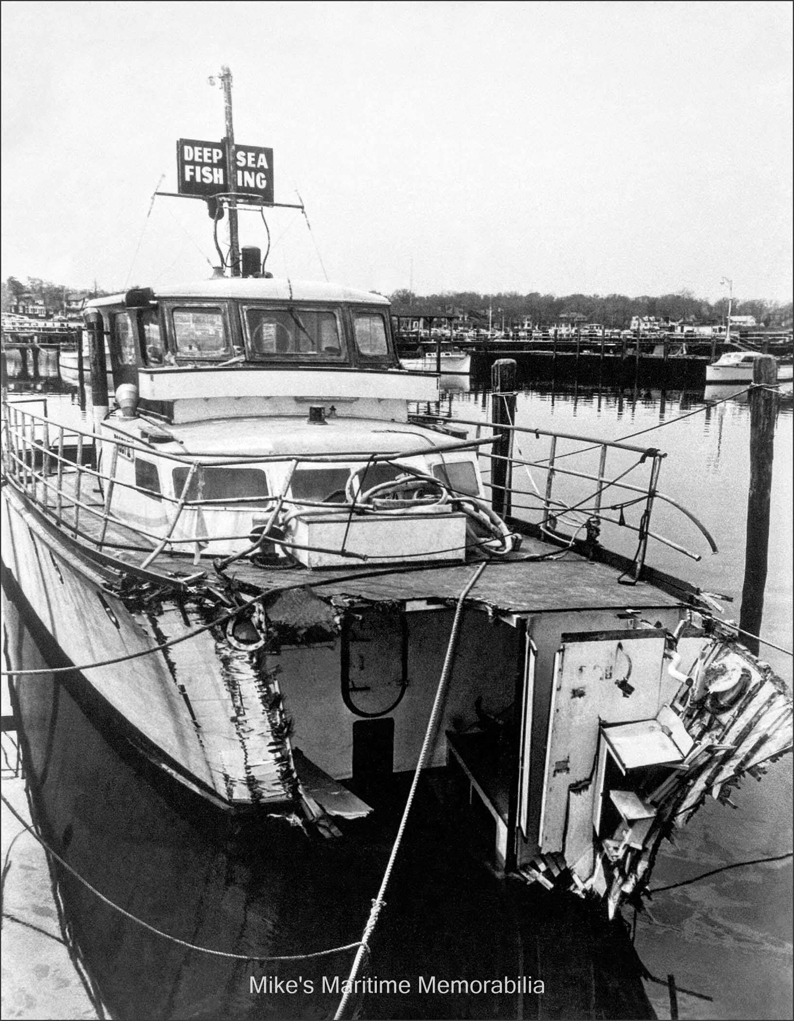 BOBBY II, Belmar, NJ – 1955 The "BOBBY II" back at her berth at Belmar, NJ after she was rammed by the 439-foot, 7,650-ton freighter, "PRESIDENT BUCHANAN" while fishing at the Cholera Banks on April 23, 1955. Thanks to her military construction, which included the now visible double forward crash bulkheads below deck, she fortunately did not sink and was even able to return to Belmar under her own power. Hundreds of people flocked to the Belmar Marine Basin to get a first-hand look at this amazing vessel.