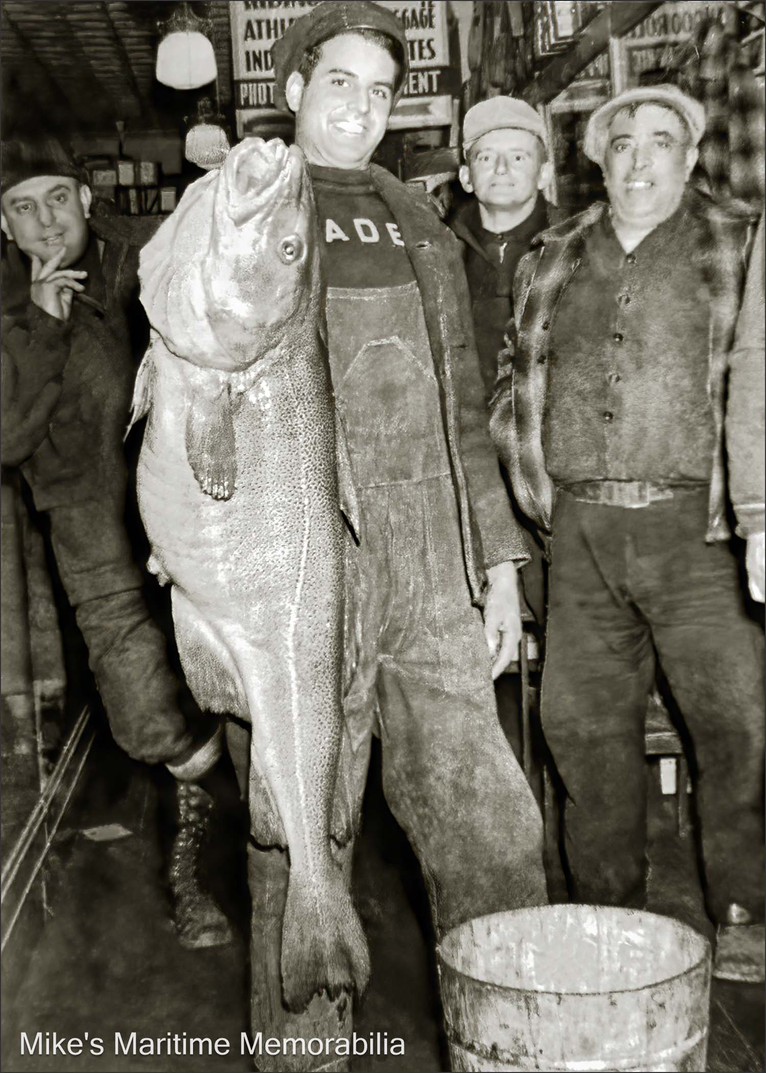 Anthony and Louis Castellano, Hoboken, NJ – 1939 Anthony Castellano hoists a jumbo codfish caught aboard the deep sea fishing boat "PALACE" during the fall of 1939. Looking on (on the right and wearing the plaid jacket) is his father, Louis Castellano. Louis Castellano was the founding father of the "PALACE" fishing fleet that was responsible for bringing the original "PALACE" to Hoboken, New Jersey in 1930. The "PALACE" name would continue in the party fishing boat business for the next 64 years. The photo is courtesy of Phil Castellano.