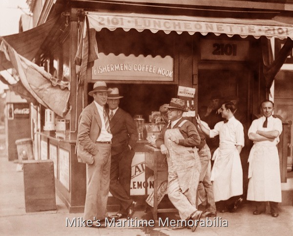 Fishermen's Coffee Nook, Brooklyn, NY – 1925 A 1925 photo of the "Fishermen's Coffee Nook" that was once located on Emmons Avenue (at the corner of East 21st Street) at Sheepshead Bay, Brooklyn, NY. From left to right in the photo and wearing their Sunday best suits and hats are Captain Fred Wrege of the party boat "EFFORT II" and Captain John 'Candy' Keefe of the party boat "TAMBO". And wearing canvas coveralls is Captain 'Charlie' Freiberger of the party boat "ADMIRAL". If you asked for a Caffè Latte Supremo Grande here, they would probably chase you down the street.