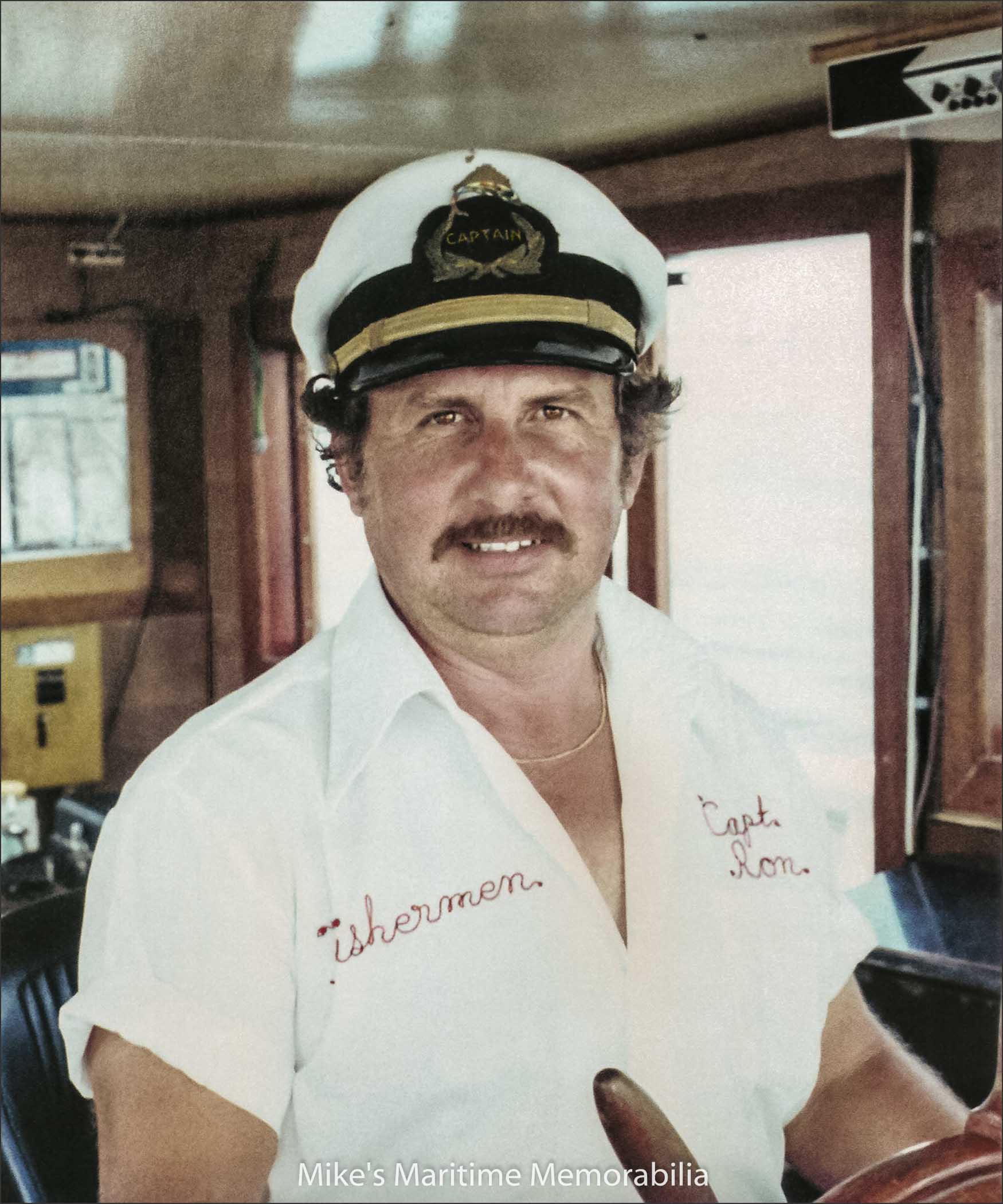 Captain Ron Santee Sr., Atlantic Highlands, NJ – 1974 Captain Ron Santee Sr. at the helm of the "FISHERMEN" from Atlantic Highlands, NJ circa 1974. Captain Ron's fishing career started in 1955 when he passed his Coast Guard exam at the age of 19. The following year he started operating an old 45-footer named the "FISHER BOY" from the Sandy Hook Bay marina. He then sailed from the Highlands Marina for several years before renaming the boat "FISHERMEN" and moving the business to Atlantic Highlands, NJ. His second "FISHERMEN" was a converted Air Sea Rescue boat and his third "FISHERMEN" was a Stevenson built boat. In 1985, a new "FISHERMEN" boat arrived from Lydia Yachts at Stuart, FL and it is still sailing today. After a successful career, Captain Ron retired in 2001 and Captain Ron Jr. took over the family business. Captain Ron Sr. is still a daily fixture on the boat and hasn't lost his passion for fishing.