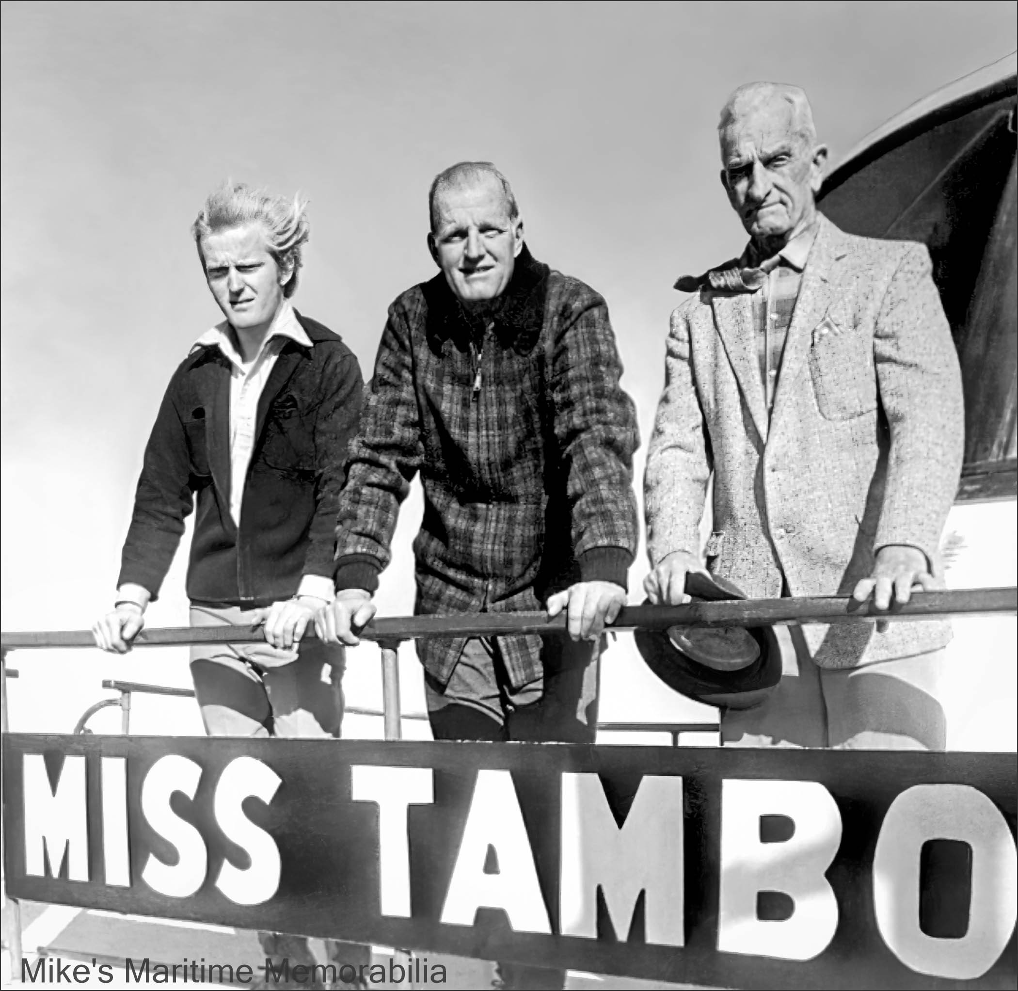 Three Captains Keefe, MISS TAMBO, Brielle, NJ – 1971 Three generations of Keefe family Captains. Standing aboard the "MISS TAMBO" at Brielle, NJ circa 1971 are, from left to right, Captains Ed Keefe Jr., Ed Keefe Sr. and John "Candy" Keefe. Captain "Candy" Keefe was a legend in the party boat industry and he got his nickname in 1904 (at the age of 14) when he began working as a candy vendor aboard the triple-decker sidewheeler steamboat "TAURUS". He went on to own and operate the "ADA L" from Sheepshead Bay and in 1923, began sailing the original "TAMBO" from Sheepshead Bay, Brooklyn, NY. In 1930, he had the "TAMBO III" built, and in 1936, he relocated the family business to Brielle, NJ. His son, Ed Keefe Sr. was the skipper of the charter boat "TAMBO V" from Brielle, NJ and took over the helm of the "TAMBO III" from his Dad in 1956. In 1962, the Gillikin built "MISS TAMBO" replaced the "TAMBO III". Ed Keefe Jr. mated aboard the "MISS TAMBO" until entering the U.S. Navy. Soon after completing his military service, Ed Jr. continued the family tradition and earned his captains license.