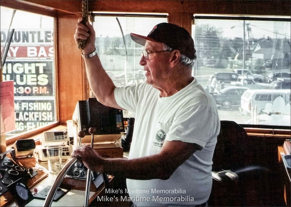 PARAMOUNT, Brielle, NJ – 2004 Captain John W. Long Jr. at the helm of the "PARAMOUNT" at Bogan's Basin, Brielle, NJ circa 2004.