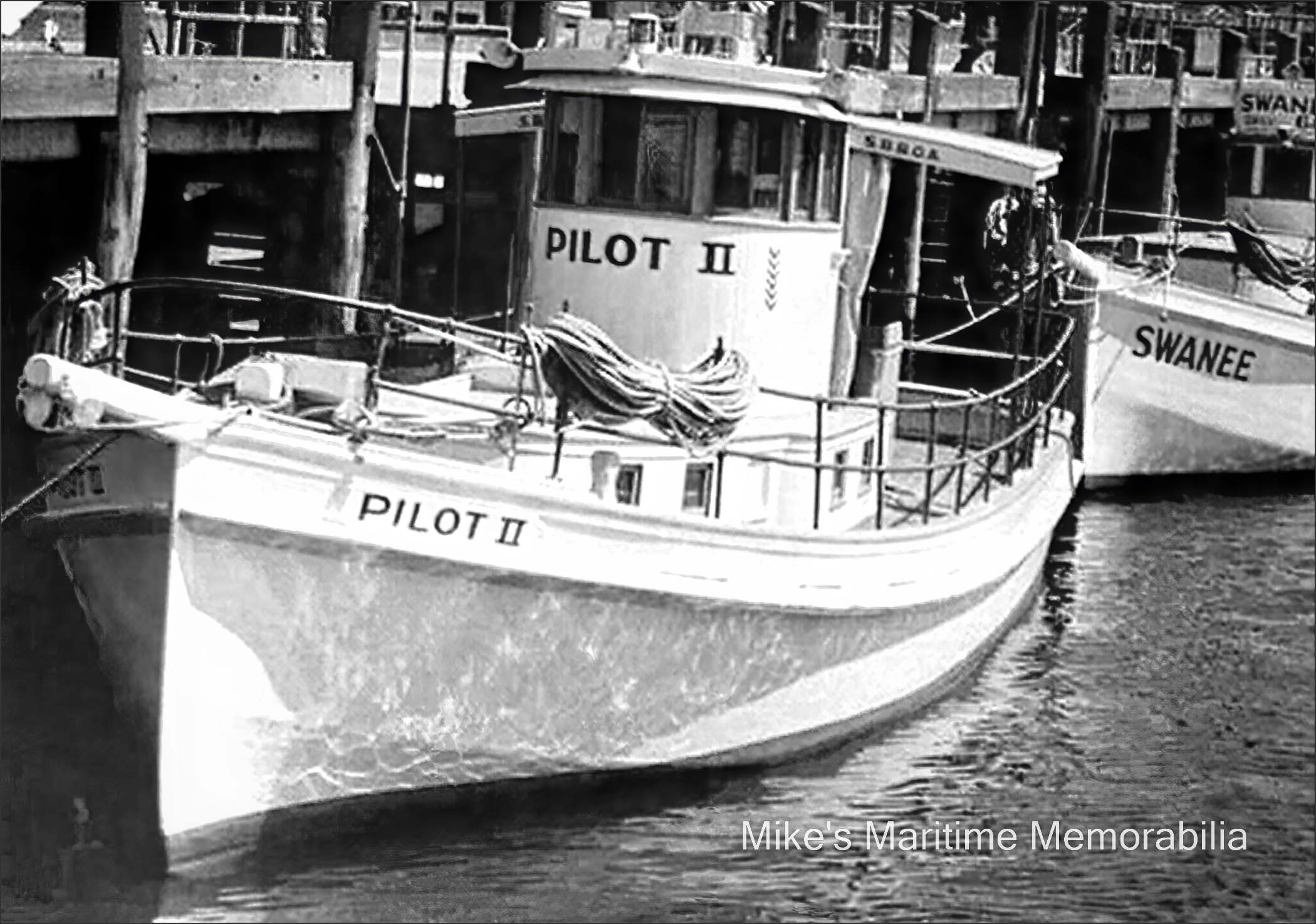 PILOT II, Brooklyn, NY – 1949 Captain Harry Phillips' "PILOT II" and Captain Otto Behensky's "SWANEE" at Pier 7, Sheepshead Bay, Brooklyn, NY circa 1949. Ernest Fiedler built the "PILOT II" in 1937, and the "SWANEE" was built in 1938 at Patchogue, NY. Notice the chevrons painted on the wheelhouse of the "PILOT II". The government appropriated many local party boats during World War II for service as costal patrol boats and each chevron represents a year of military service. Also, the "PILOT II" was a member of the Sheepshead Bay Boat Owners Association as indicated by the "S.B.B.O.A." painted on her overhang. Years later, a young Tom Marconi started his career as a mate on this boat. Captain Phillips became Tom's mentor and sold the business to him when he retired in 1974. The "SWANEE" would later be owned by Captain Fred Ardolino. Captain Ardolino later sold her to Captain Charlie Roth who relocated her to Gerritsen Beach, Brooklyn, NY where she sailed as the "WOODEN SHOE II".