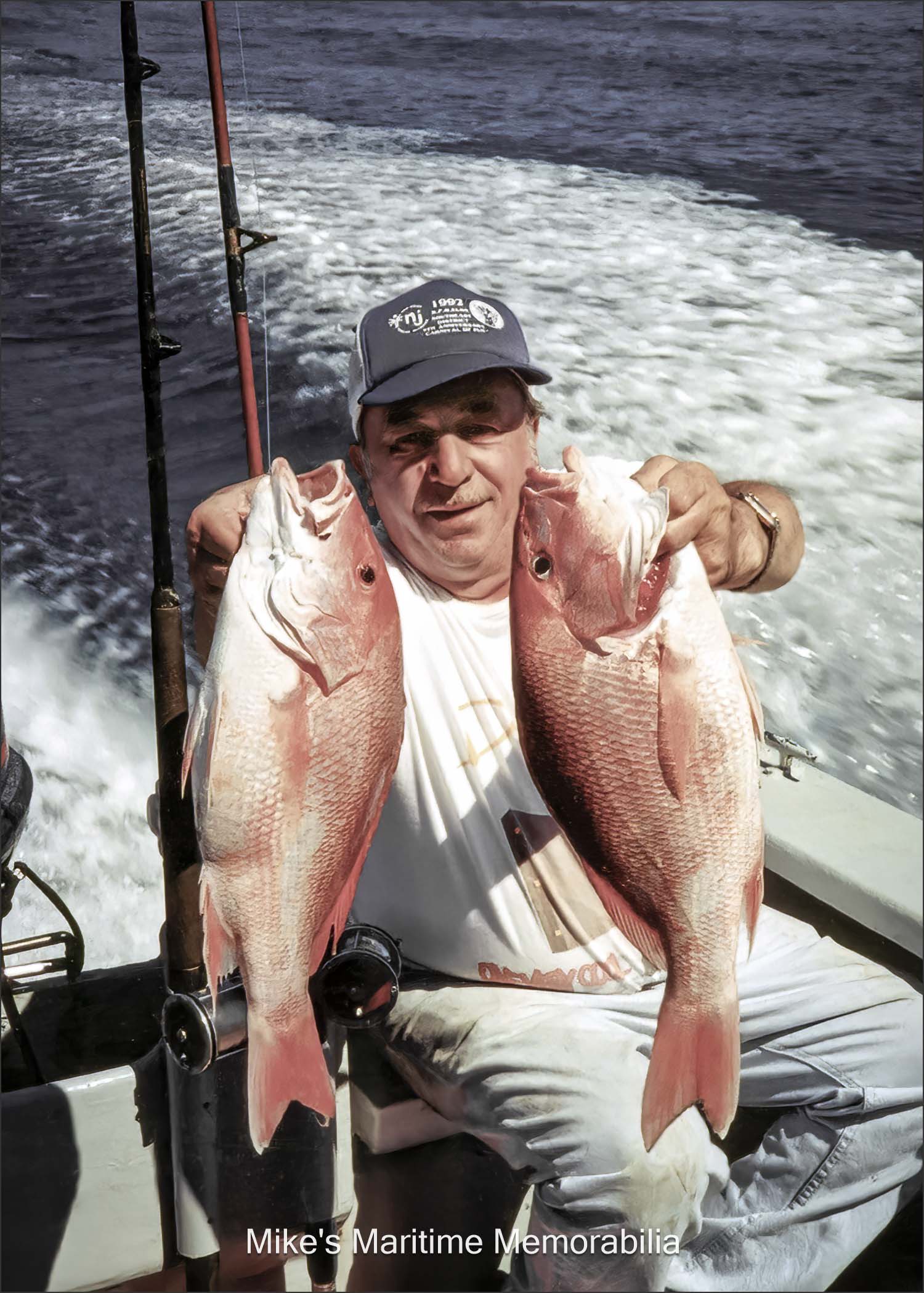 Captain Mickey fishing in Florida Captain Mickey holds up a nice pair of Snapper on the way back from a fishing trip. The photo is courtesy of Captain Dave Bogan Sr.