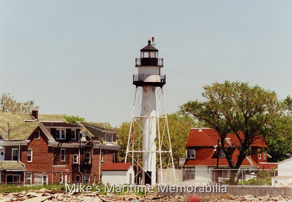Norton Point Light, Coney Island, NY – 1999 The Norton Point Light [40° 34' 36" N – 74° 00' 42" W] on the western end of Coney Island, Brooklyn, NY circa 1999. The light is a 75-foot tall square steel skeleton tower that was built in 1890 and has a flashing red light every 5 seconds. Interestingly, this light had a lightkeeper until it was automated in 1989. Mr. Frank Schubert had been the lightkeeper since 1960 and was the last civilian lightkeeper for the US Lighthouse Service. Even though he was retired, Mr. Schubert remained as the guardian of the light in the keeper's home next door. He also served as lightkeeper at the Old Orchard Shoal Lighthouse in Raritan Bay. Mr. Schubert passed away in 2003.