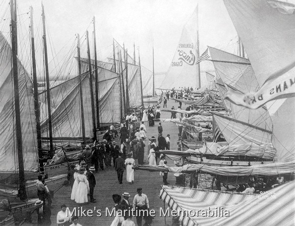 ATLANTIC CITY YACHTSMEN'S ASSOCIATION PIER, Atlantic City, NJ – 1898 The Atlantic City Yachtsmen's Association Pier was built in 1883 and offered a selection of nearly 100 vessels for daily fishing trips and sailing excursions. The vessels of this era were primarily catboats and sailing sloops as seen in this vintage photo. Garb for fishing or excursions was dressy and consisted of full dresses and large hats for the ladies, and suits, ties and straw 'Skimmer' hats for the men. Many of the larger catboats carried ads on their sails, such as the vessel at the end of the pier advertising "Eisenlohr's Cinco Cigars". The pier was later reduced to half its original size and eventually become the famous "Starn's Pier". Photo courtesy of Don Nyce.