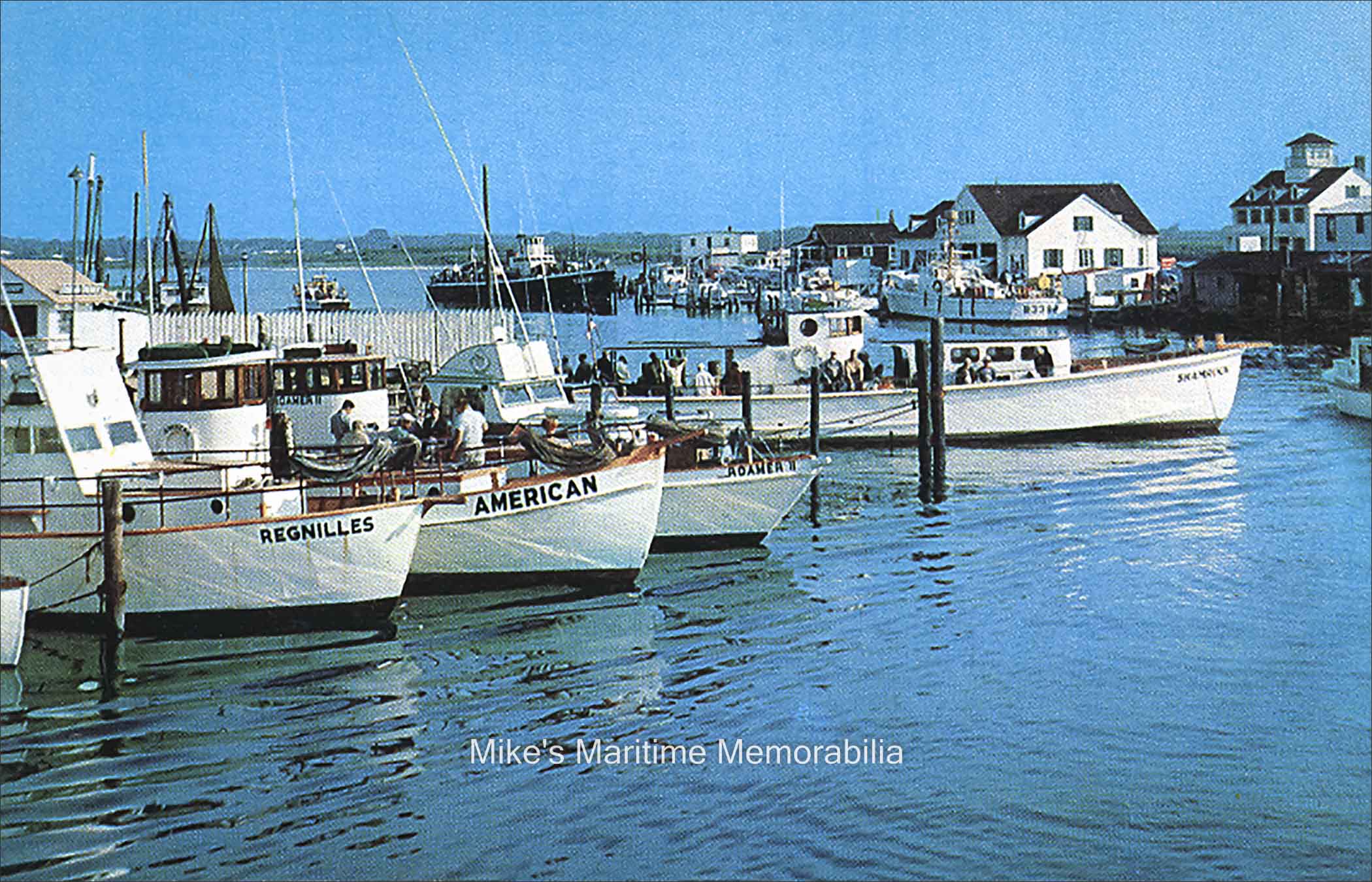 BROADWAY BASIN, Point Pleasant, NJ – 1958 Broadway Basin at Point Pleasant, NJ circa 1958. Seen in this color photo are the Captain Ed Sellinger's "REGNILLES" (his name spelled backwards), Captain Lou Nyhammer's "AMERICAN", Captain John Basnar's "ROMER II", Captain Jack Bogan's "SHAMROCK", and in the background Captain Harry Tonks' "YANK". Captain Sellinger was an expert welder and personally built the 45-foot steel hulled "REGNILLES" in 1951 at Newark, NJ. The 45-foot "AMERICAN" was built in 1945 by Johnson Brothers Boatworks at Bay Head, NJ and originally sailed as the Bogan Fishing Fleet's "PARAMOUNT V". The 45-foot "ROAMER II" was built in 1916 at New York, NY and originally sailed from Sheepshead Bay, Brooklyn, NY. The 65-foot "SHAMROCK" was built in 1953 by the Van Sant Boat Yard at Atlantic City, NJ and she was the first party boat ever built with a flush deck, that is, her cabins and heads were located on the main deck. In 1971, Captain Bogan sold the boat to his mate, Bob Pennington and she became his first "SEA DEVIL". The 110-foot black-hulled "YANK" was built in 1942 by Mantis Yacht Co. at Camden, NJ as the World War II U.S. Navy Sub Chaser "SC-635". It last sailed as the "BRONX QUEEN" and on December 20, 1989, she encountered rough seas while Whiting fishing near the entrance to Ambrose Channel. She lost a plank in her bow causing her to sink in less than twenty minutes.