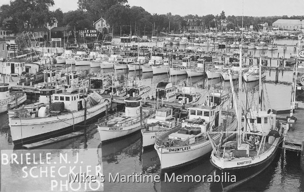 BRIELLE, NJ FISHING FLEET – 1950 The Brielle, NJ fishing fleet circa 1950. A collection of party fishing boats including the "DAUNTLESS", the "PARAMOUNT I", the "PARAMOUNT II", the "FRISCO", the "AMERICAN", the "LADY ANN", the "TAMBO III, the "TAMBO V", the "FLAMINGO II", the "CHAPPIE I", the "CHAPPIE II", the "CHAPPIE III", the "ESCORT", the "TEEPEE", the "SEA LADY", the "GOODY II", the "BAR Q", the "SEA FOAM", the "ELEGANCE", the "DOLPHIN I", the "DOLPHIN II", the "ALBATROSS", the "SEA HAWK", the "CHICKEN II", the "MR. BILL II", the "EVELYN", and Gulf and ESSO fuel docks.