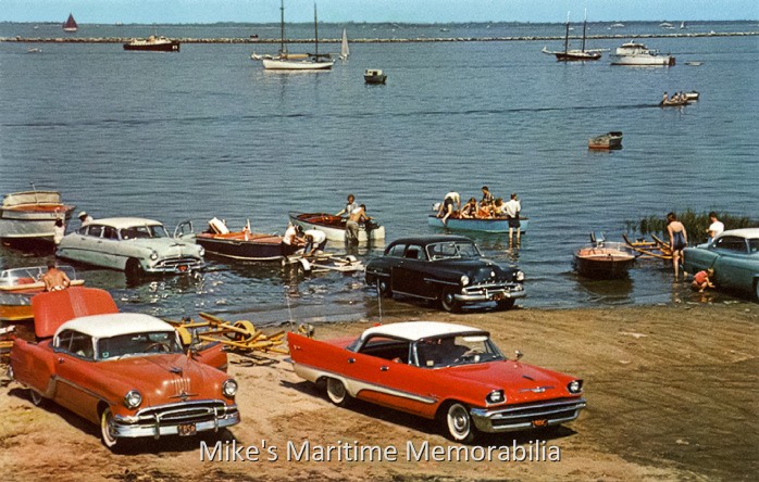 ATLANTIC HIGHLANDS, NJ MUNICIPAL LAUNCH RAMP – 1957 Weekend activity at the municipal launch ramp at Atlantic Highlands, NJ during the summer of 1957. Back then, most ramps were just sand that was bulldozed out into the water. Boat trailers were all float-on models and you had to get your car very wet to launch the family 'yacht'. The bigger the boat, the further out in the water you went with your car and trailer. You got wet too; there were no floating docks and a bathing suit or shorts were necessary attire. The family autos in the photo include a 1953 Hudson Hornet and 1952 Dodge Meadowbrook in the background, and a 1954 Pontiac Star Chief and a shiny new 1957 DeSoto Fireflite Sportsman in the foreground.