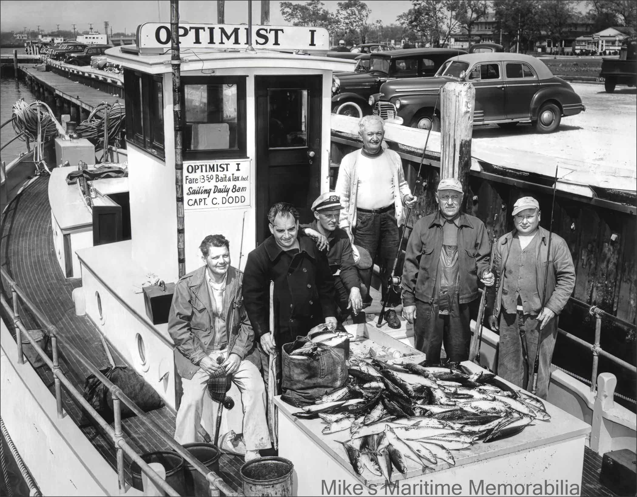 OPTIMIST I, Belmar, NJ – 1951 Captain Charlie Dodd is shown here with a group of 'regulars' after returning from a day of Mackerel fishing aboard his "OPTIMIST I" in the spring of 1951. In 1939, Captain Dodd was the first party boat operator to sail from the newly opened Belmar Marina at Belmar, NJ. Ernest Feidler built the "OPTIMIST I" in 1946 at his Bergen Beach Boatworks at Brooklyn, NY. She was sold in 1952 and became Captain Doug Macintosh’s "IDEAL I" from Point Pleasant Beach, NJ. The photo is courtesy of Ray Dodd.