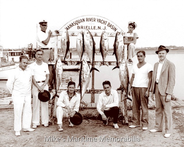 MANASQUAN RIVER YACHT BASIN Tuna Catch – 1940 A nice catch of 'Mud Hole' tuna caught in 1940 by the group fishing aboard the "AJAX" from the Manasquan River Yacht Basin, Brielle, NJ. The Bogan family owned the "AJAX" and Captain Frank Stires was the operator. White bucks and saddle shoes were the footwear of choice for fashionable anglers of the day. Oh yeah, don't forget to put a nice crease in your fedora hat.
