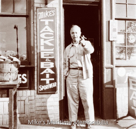 MIKE'S TACKLE & BAIT SHOP, Brooklyn, NY – 1946 Proprietor Mike Maffai is shown standing in the front of his bait and tackle shop located on Emmons Avenue in Sheepshead Bay, Brooklyn, NY circa 1946. Mike operated the tackle concession aboard the party boat "WHITBY II" before opening his own shop soon after World War II ended. Notice the bushel basket of skimmer clams on the table. Photo Courtesy of the Captain Fred Wrege and Charles VanDerVoort families.