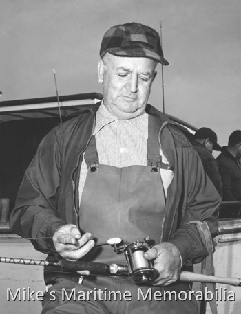 Fishing Tackle – 1954 State-of-the-art fishing tackle in the Fall of 1954. Angler Ray Grey from Fords, NJ shows off his brand new Penn Squidder reel and fiberglass boat rod.